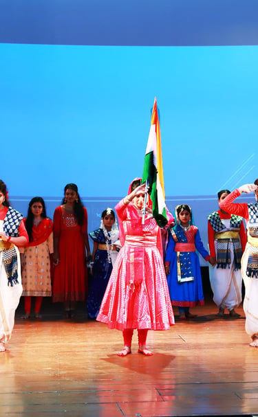 Young students performing a graceful kathak dance on stage at Rabindratirtha auditorium