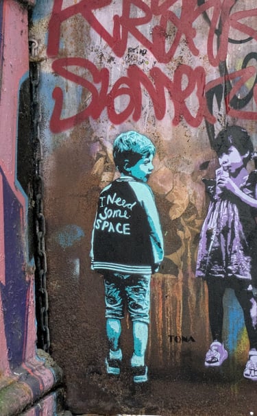Street art at Rote Flora Hamburg with children stencil graffiti, urbane Kunst und Graffiti Szene in St. Pauli