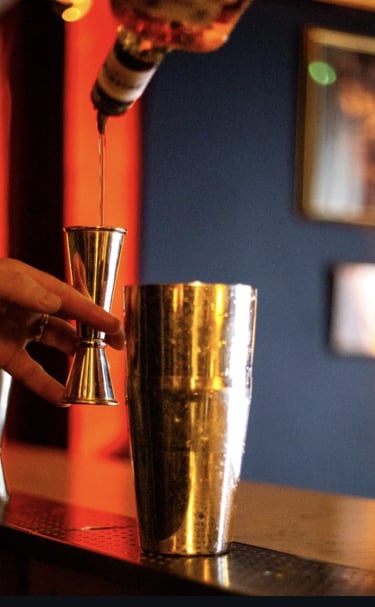 bartender crafting cocktail at stolen moon speakeasy paris