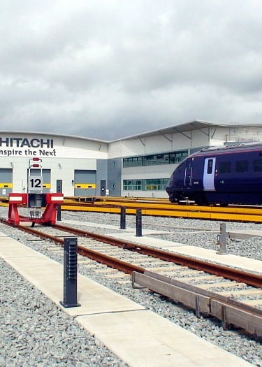 New rail maintnance shed with blue Javelin train standing on the aproach road to the shed