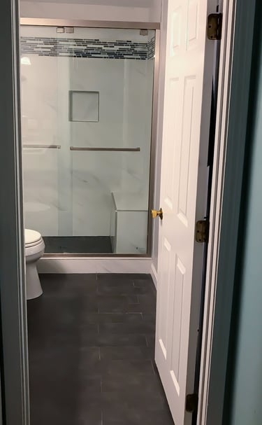 a bathroom with a shower and a toilet