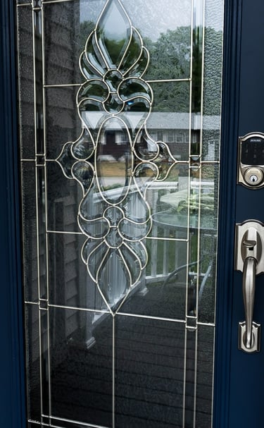 a door with a glass door and a door handle