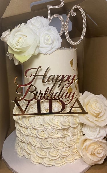 a cake with a 50th birthday cake topper