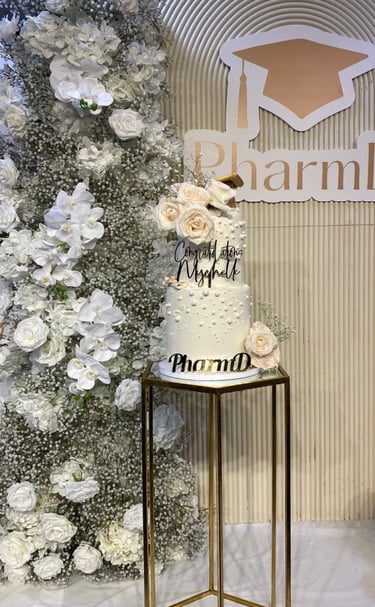 a cake with a cake topperf and flowers