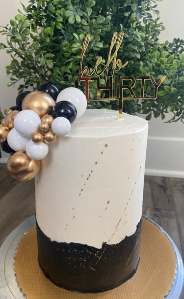 a cake with a hello kitty cake topperf