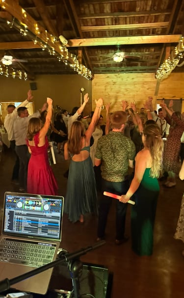 a group of people dancing at a party