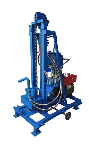 Portable hydraulic water well drilling rig with a blue steel frame and diesel engine.