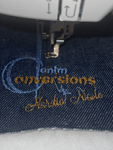 Denim Conversions denim handbag logo stitched on denim fabric
