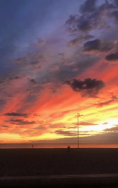Sunrise at Malvarrosa Beach with reddish hues