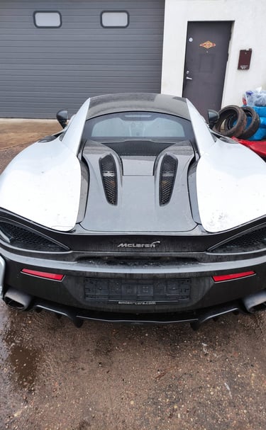 an Enlab McLaren car with a large hood and a hood on it