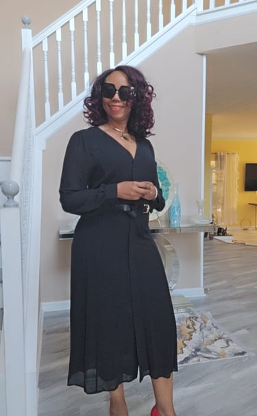 a woman in a black dress and red shoes