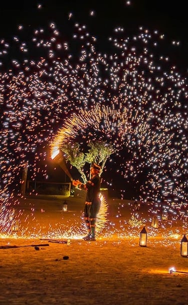 a man standing in front of a firework