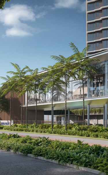 Modern luxury condominium building with glass amenities pavilion and palm tree landscaping.