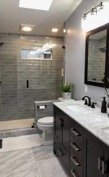 Bathroom remodel with updated tile, modern fixtures, and a clean, functional design.