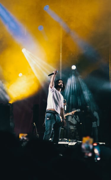 a man standing on a stage with a microphone and a microphone, festival de jazz, montreal