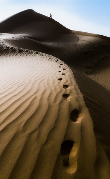 a person walking on a sand dune dune dune dune dune dune dune dune dune dune