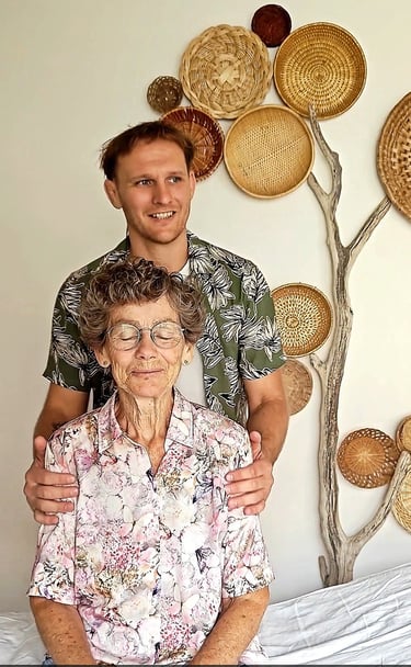 a man and woman standing in front of a wall with baskets