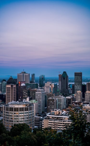 a city skyline with a blue sky and a few buildings, montreal photographer