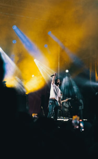 a man standing on a stage with a microphone and a microphone, festival de jazz, montreal
