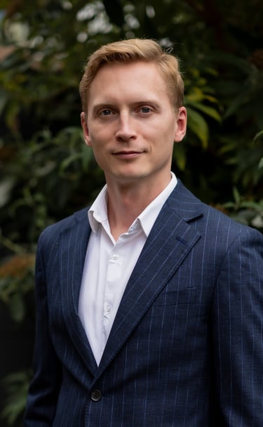 Photo of Misha Verkerk ENT Consultant in a blue suit