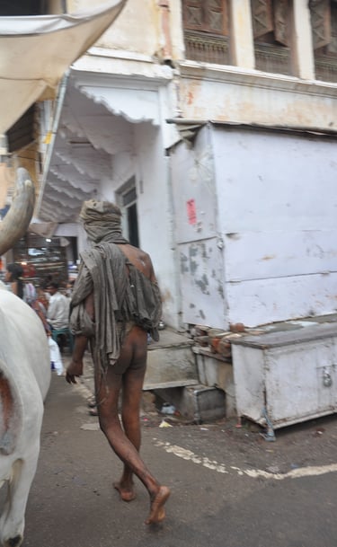 naked man walking the streets of Pushkar , Rajasthan, India