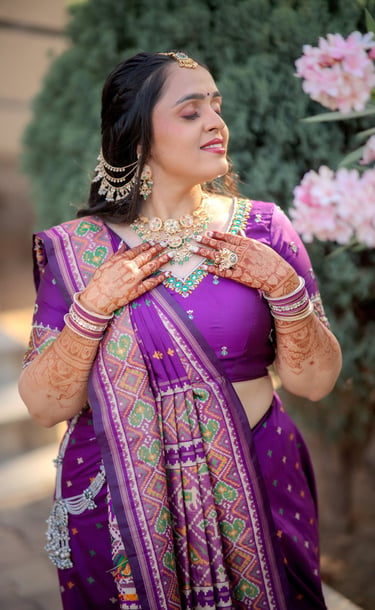 "Indian bride in royal purple Patola silk saree with full-arm bridal mehendi and kundan jewellery — 