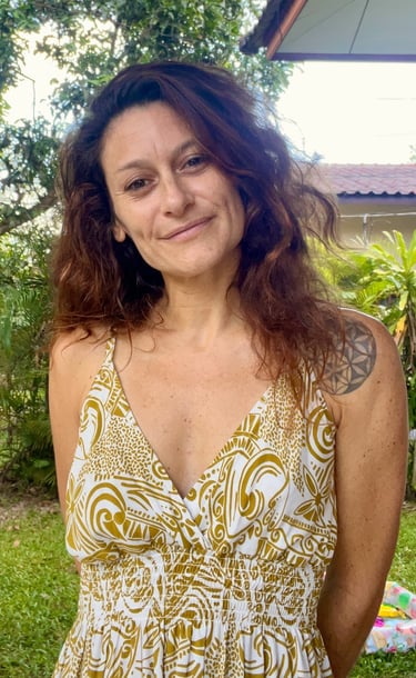 a woman with a tattoo on her chest and a tattoo on her chest