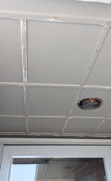 Trim boards nailed to a front porch ceiling
