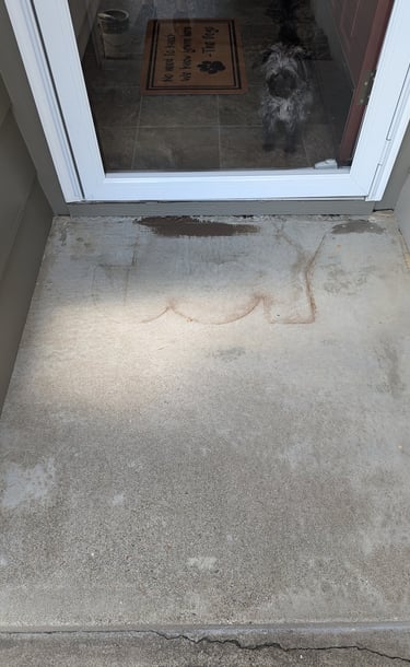 Concrete front door stoop with Joy outline
