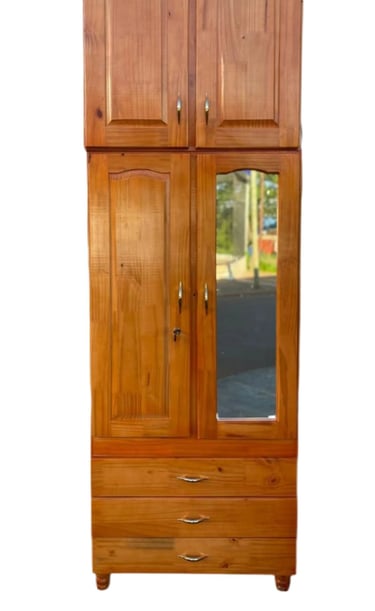 a wooden armoire with a mirror and a mirror