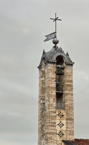 a clock tower with a weather vane and weather vanes