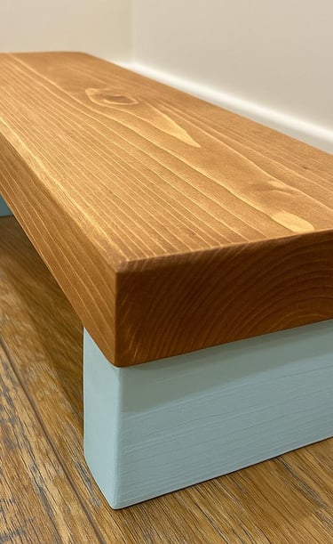 a wooden step stool with a wooden  top