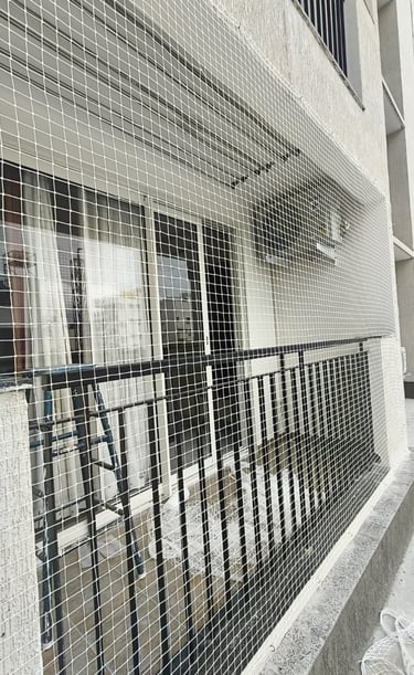 Close-up of strong mesh netting fitted perfectly on a window frame.