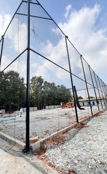Close-up of sturdy volleyball nets stretched tightly over a terrace sports area.
