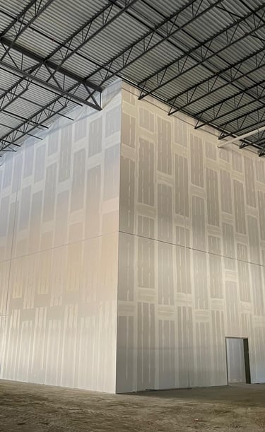 a large white industrial warehouse wall smooth finished walls