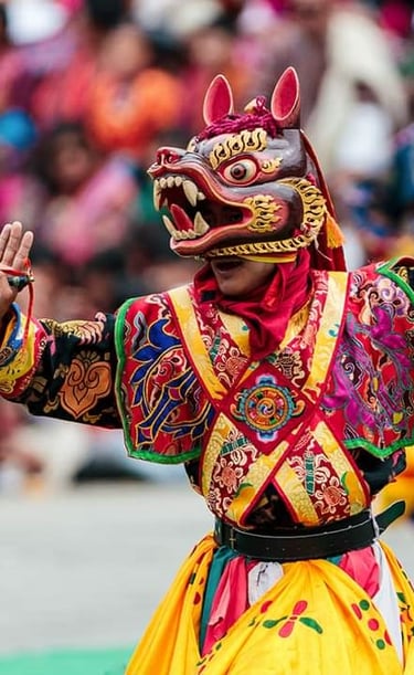 Dancer_potraying_meaningful_hand_gestures_during_annual_religious_masked_dance_festival_in_Thimphu