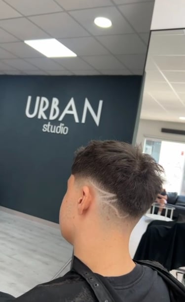 a man with a haircut and a haircut