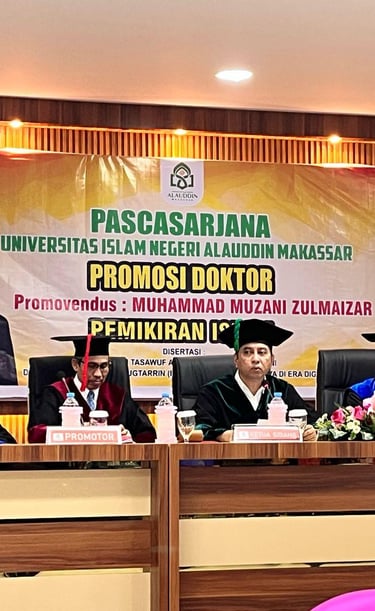 a group of people sitting at a table with a banner on it