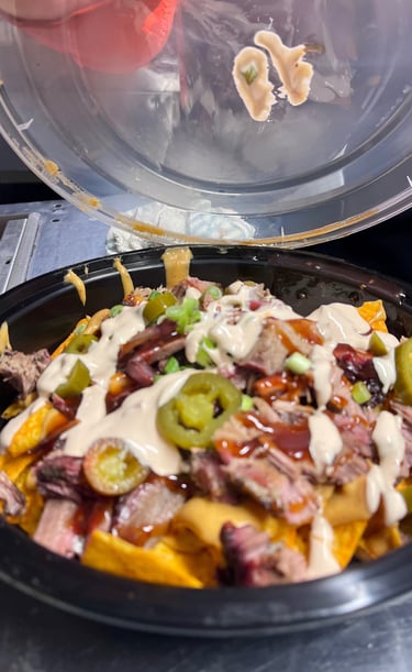 Not Cho Mama’s Nachos loaded with brisket, cheese, jalapeños, and BBQ drizzle from Marion Ohio 