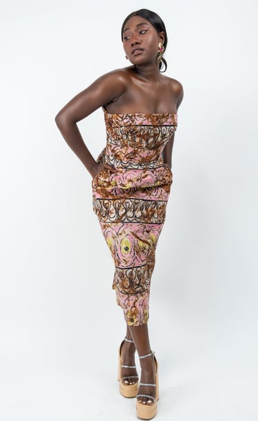 a woman in a dress with abstract print