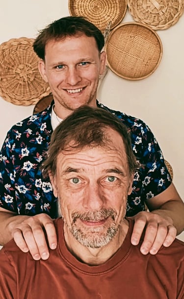 a man with a beard and other man with a red shirt