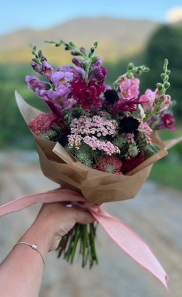 Handheld bouquet of delicate flowers
