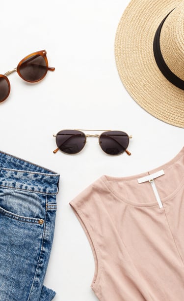 Close-up of elegant accessories and makeup products arranged artistically.