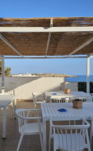 a table with chairs and a table with a bowl of food