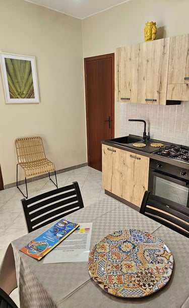 a kitchen with a table and chairs and a table