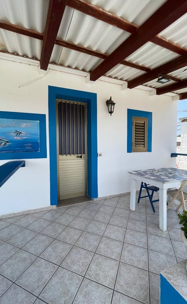 a patio with a table and chairs and a table