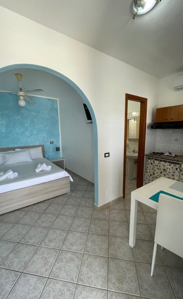 a bedroom with a bed and a table