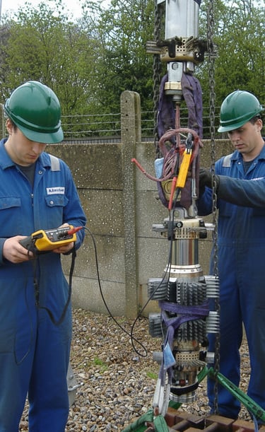 a group of men in blue workwears and safety gear