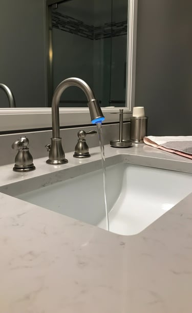 a sink with a faucet and a towel