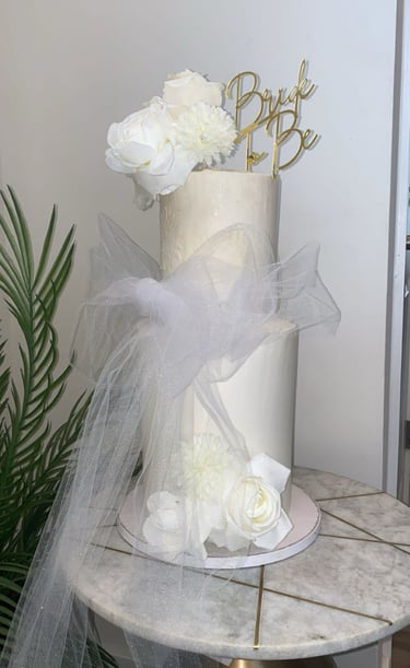 a cake with a white cake topperf and a cake topperf